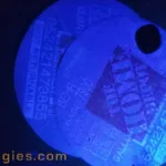 Image of a faded thermal printed label under 365nm blacklight.